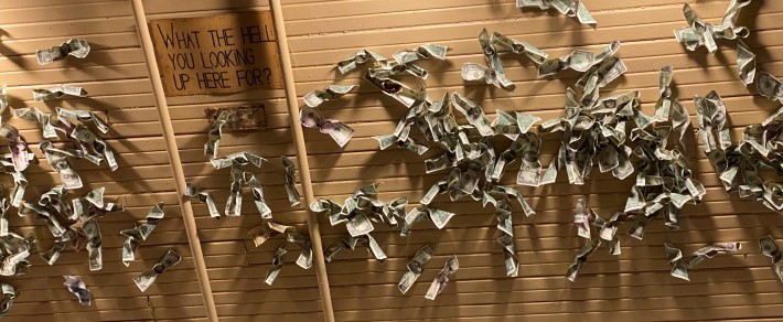 Dollar bills on the ceiling at Baumgartner's Cheese Store and Tavern