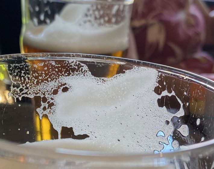 Foam on a beer glass.