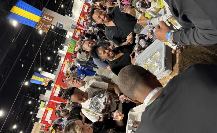 Sideways view of brewers serving beer at the Great American Beer Festival