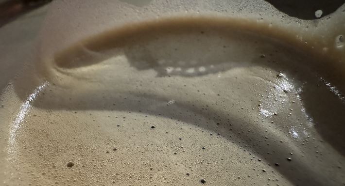 Foam on a pint of beer at Hogshead Brewing in Denver, Colorado