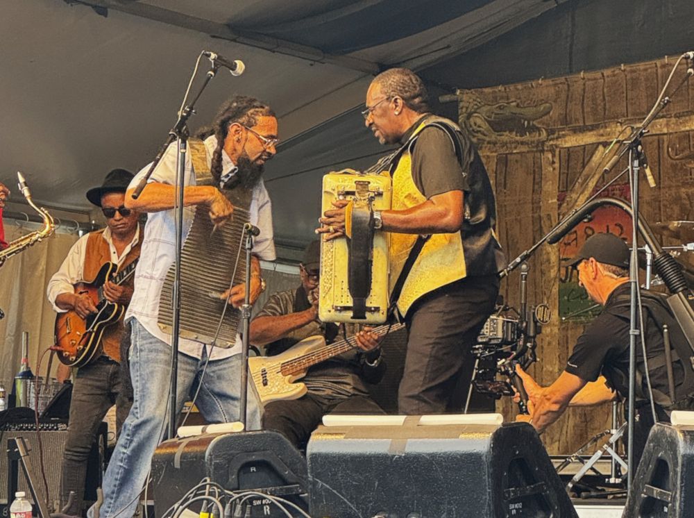 Buckwheat Zyedco Jr. and his son playing on the Fai Do Do stage at Jazz Fest