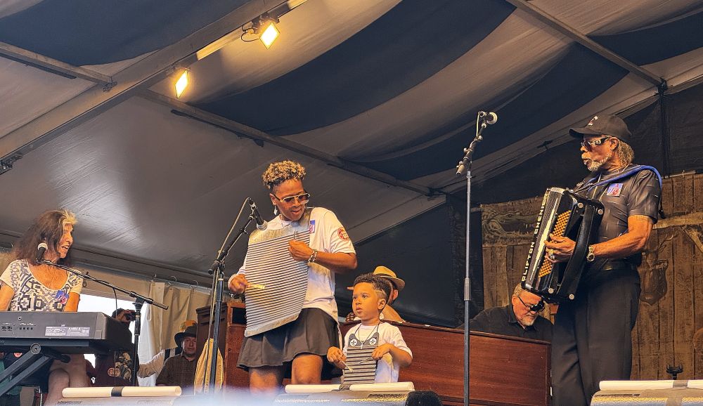 CJ Chenier and bandmates (including Marcia Ball and David Hidelgo) during a tribute to his father, Clifton Chenier, at Jazz Fest