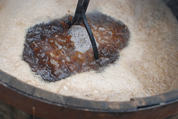 Lower hot stones into wort at Scratch Brewing